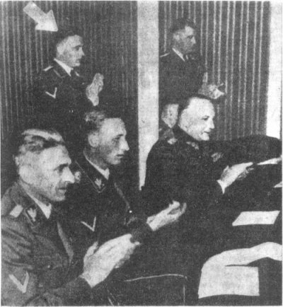 Three SS men: from the left: Karl Frank, Rudolf Heydrich (sitting) and Theodore Oberländer (standing)